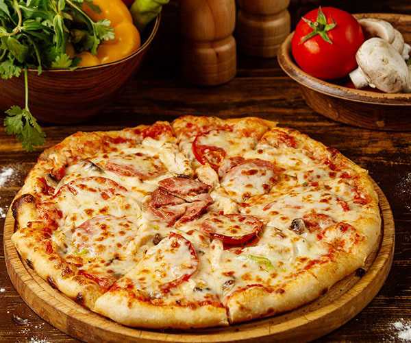 Hot cheesy stuffed crust pizza freshly baked to order at Cafe India in Renfrew.
